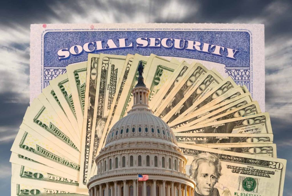 A composite image showing the dome of the U.S. Capitol Building in the foreground, partially obscuring a fan of U.S. twenty-dollar bills. Behind the money, a blue and white Social Security document is visible, with the words 'SOCIAL SECURITY' prominently displayed. The background is a dark, cloudy sky.