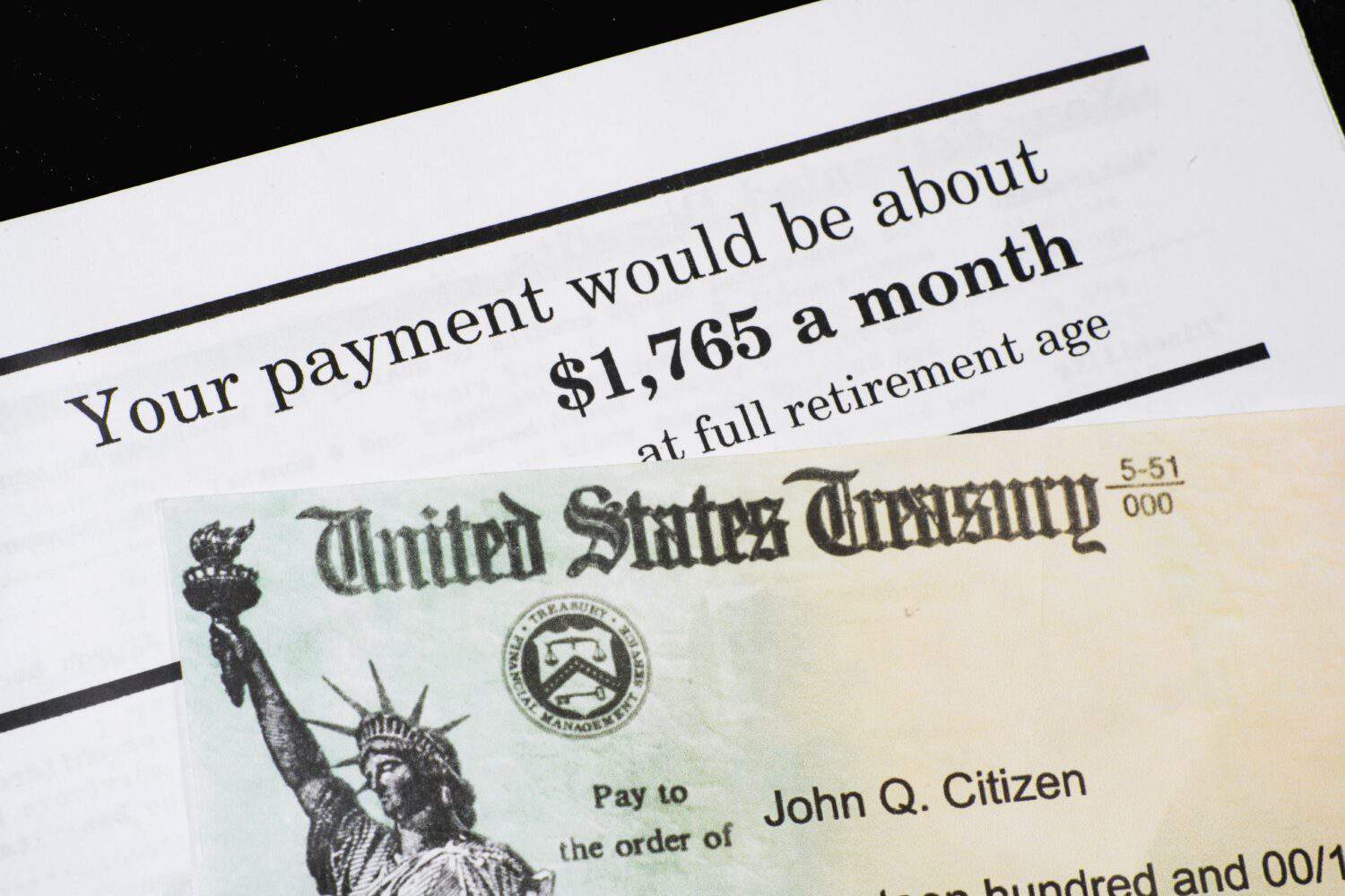 A Corner of Social Security Administration annual statement showing benefits amount at full retirement age with SSA check. Concept of retirement planning.