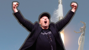 A triumphant Elon Musk, wearing a black baseball cap and a black t-shirt with 'FOUNDATION' written on it, stands with his arms raised high and mouth open in an excited expression. Behind him, a tall, slender white rocket is launching, emitting a bright orange flame and smoke from its base against a clear blue sky. A tall metal structure with robotic arms is visible to the right.