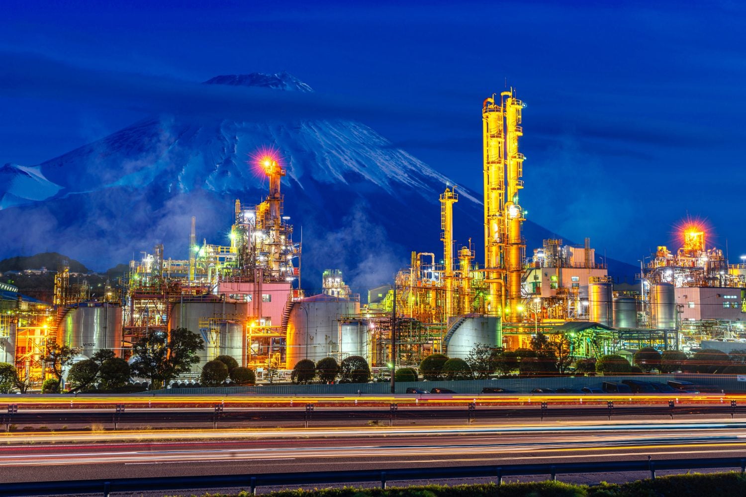 Oil refinery factory in Japan with Fuji mountain background on Night time