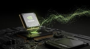 A close-up three-dimensional render of an NVIDIA processor glowing with green light, positioned above another embedded NVIDIA chip on a dark, intricate circuit board. A dynamic stream of luminous green and light blue particles flows from the elevated chip, curving upwards and to the right against a dark background, suggesting data or energy transfer.