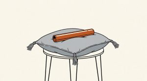 Illustration: an orange relay baton resting on a gray tasseled cushion