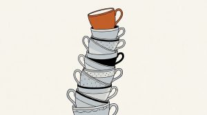 Illustration: a tall, leaning stack of teacups with an orange cup on top
