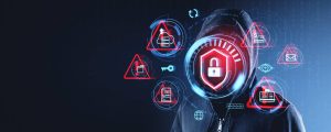 A digital graphic of a person in a dark hooded jacket, with their face obscured, set against a background of dark blue and binary code. The figure is encircled by glowing red and blue holographic icons, including a cloud with an upload arrow, a folder, a key, a prominent red shield with a white padlock on the chest, a document with a dollar sign, an email envelope, an eye with a plus sign, an identity card, a globe, and a refresh symbol, all conveying cybersecurity, threats, and data vulnerability.